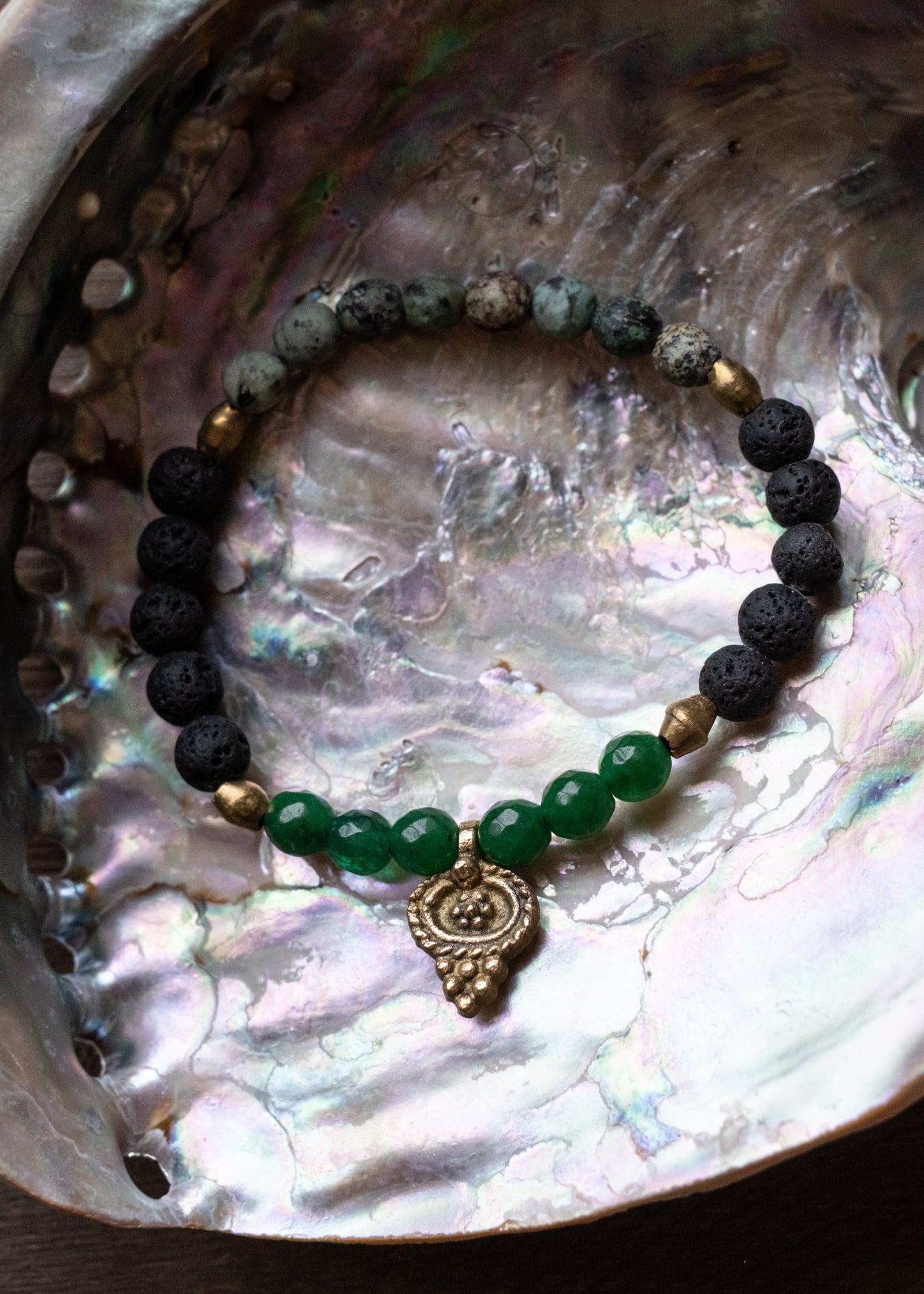 Emerald Glow Lava Stone Bracelet with Brass Talisman