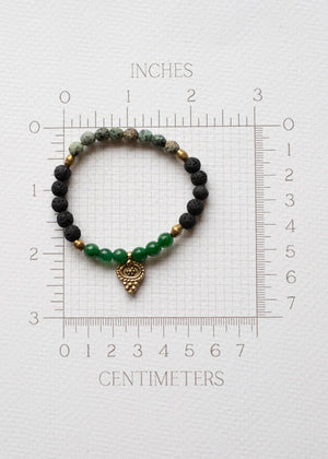 Emerald Glow Lava Stone Bracelet with Brass Talisman