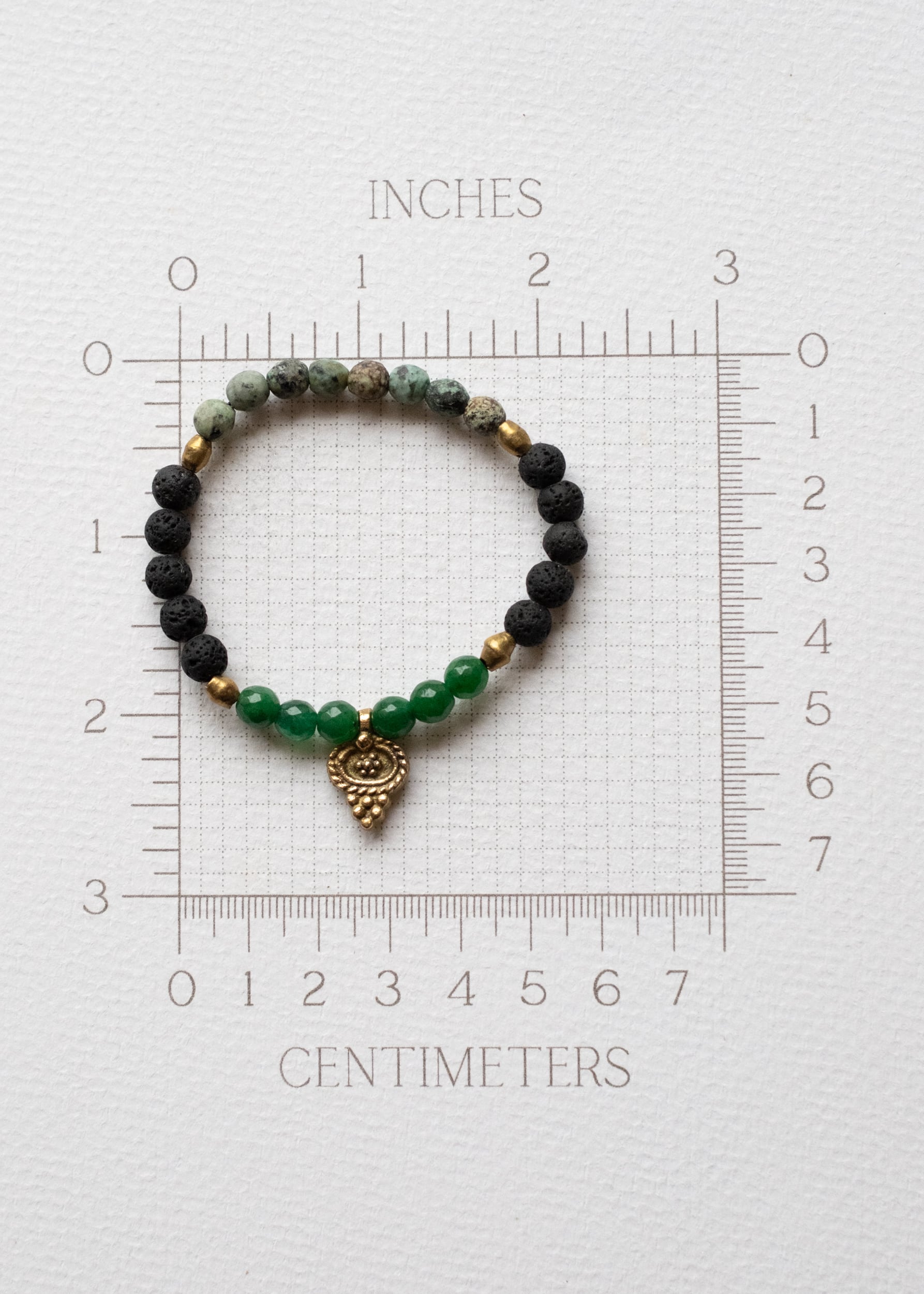 Emerald Glow Lava Stone Bracelet with Brass Talisman