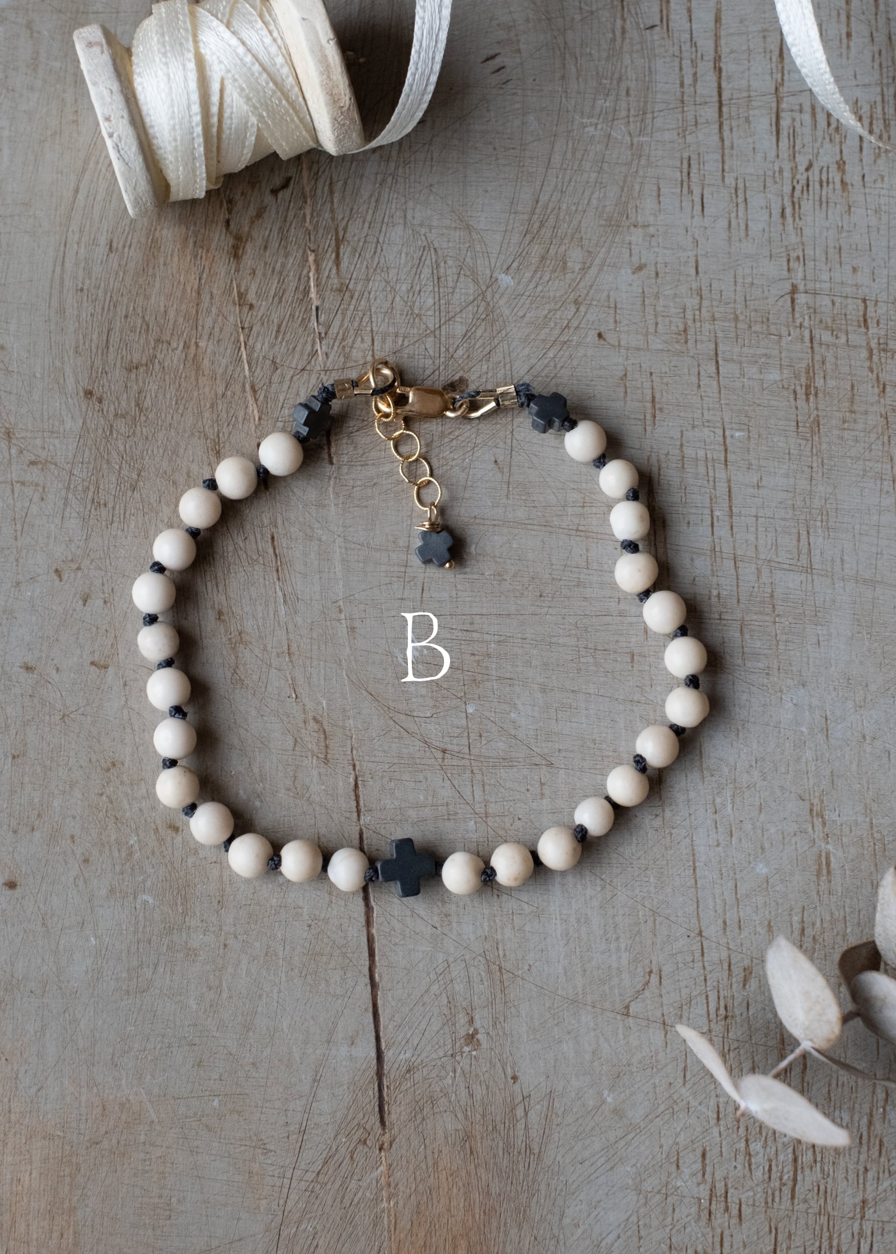 Fossil and Hematite Cross Bracelet by Atelier 363, photo c
